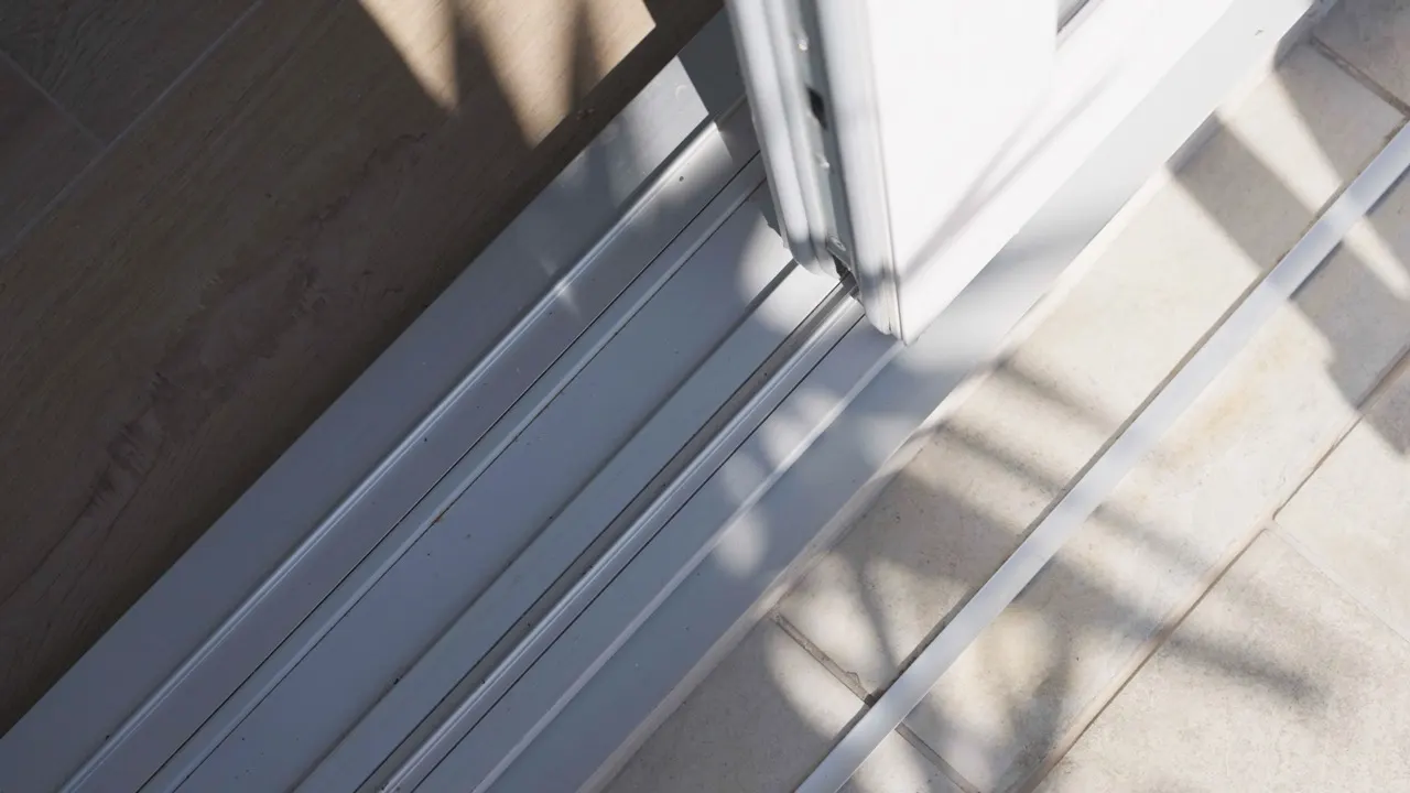 Close-up of the aluminium profile of a sliding unit against the light