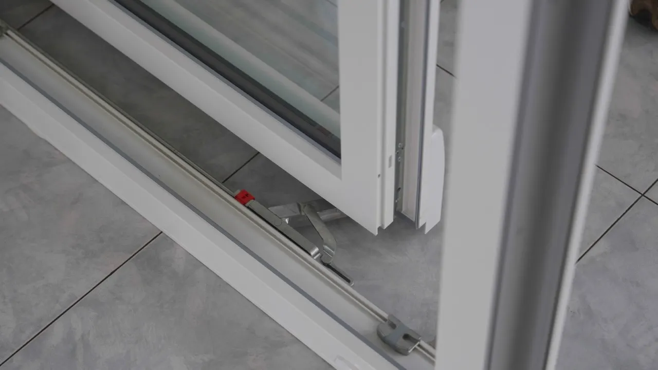 Carriage and track of a uPVC tilt-slide door