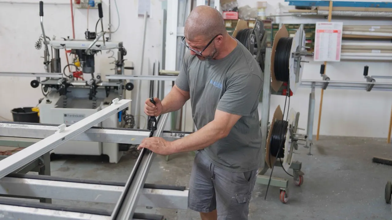 A long profile being machined in the workshop