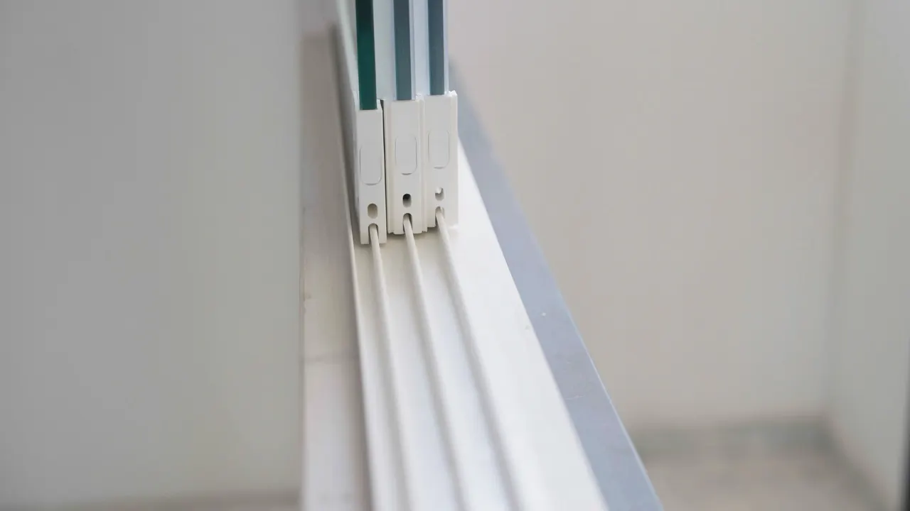 Close-up of the sash of an open white uPVC window